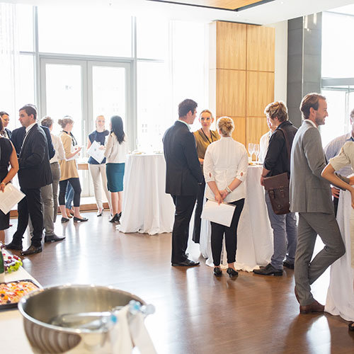 People in business casual attire in a conference setting.